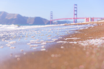 Beach and Sand with a Blurry Golden Gate Bridge in San Francisco California