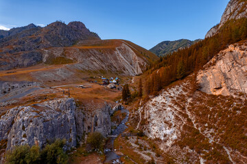 Landscape Altai mountains white rock with green forest and winding river, sunset aerial top view