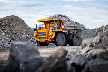 Open pit mine industry banner , big yellow mining truck for gold ore