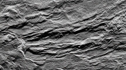 Close-up view of textured gray stone surface with intricate patterns and natural lines.