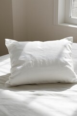 White Pillow on a Neutral Bedspread, mock up image