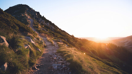 Stunning Sunset Over Mountain Trail with Warm Glow