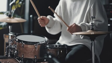 A rhythmic drumming session in a minimalist studio, Drums arranged with artistic precision, Contemporary musical style