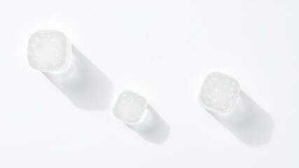 Obraz premium Water bubbles and ice cubes creating a refreshing aesthetic on a clean white background, abstract, liquid
