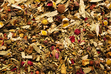 Dried herbal and floral blend tea leaves background