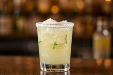Frozen lime margarita with a salted rim, served in a chilled glass, perfect for a refreshing cocktail showcase