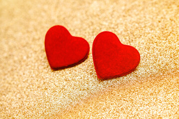 Heart symbol on a gold shiny background
