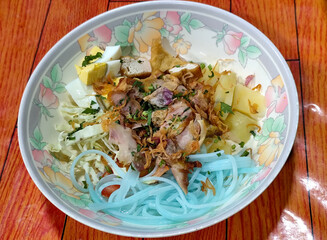 Soto Ayam in Indonesia. Soto ayam is a traditional Indonesian dish that uses ingredients such as shredded chicken, potatoes, eggs, rice vermicelli, bean sprouts with a delicious sauce.