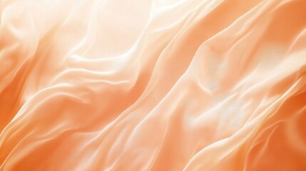 Soft orange gradient fabric texture with swirling patterns creating an abstract background for design projects and visual content.