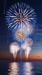 Setting off glittering blue and white fireworks in elegant bursts over the horizon