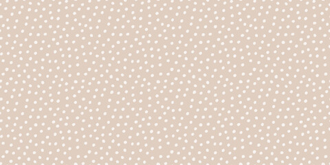 Abstract animal skin polka dot seamless texture. Minimal irregular tossed tiny dots pattern. Cute childish modern simple doodle print. Neutral beige seamless patern. Baby boho aesthetic surface design