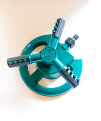 garden equipment - water sprinkler watering lawn at home backyard