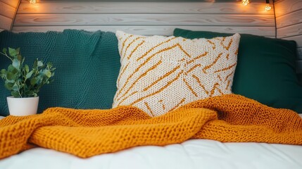 A van interior with a homey vibe featuring decorative throw blankets and soft lighting