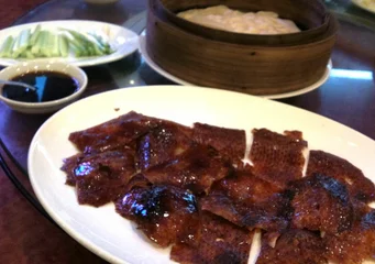 Cutting of Peking Roast Duck, Chinese style dishes that are famous in Thai restaurants