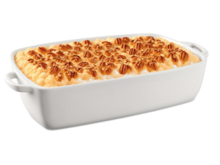 Sweet Potato Casserole A bubbling sweet potato casserole on a transparent background, with a fluffy sweet potato filling topped with