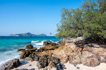 Beautiful seascape with big rock, sand beach, tree and mountain of  beautiful seascape at Koh Samaesarn, Chonburi, Thailand