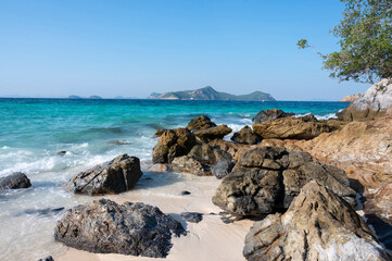 Beautiful seascape with big rock, sand beach, tree and mountain of  beautiful seascape at Koh Samaesarn, Chonburi, Thailand