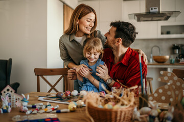 The family decorates eggs and enjoys quality time together. Easter preparations concept