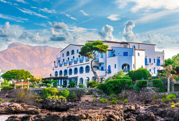summer beautiful view of nice hotel resort building in greek style on sea coast with amazing...