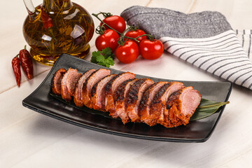 Sliced duck breast baked with cherry