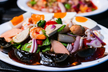 Papaya salad with preserved egg, salted egg, sausage, pork roll, salmon,  thai food, recommended thai food