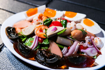 Papaya salad with preserved egg, salted egg, sausage, pork roll, salmon,  thai food, recommended thai food