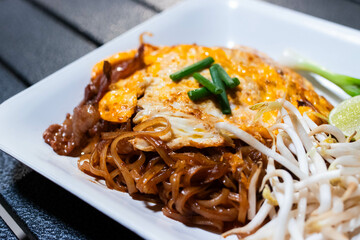 Korat stri fried noodle (Pad-Mee-Korat) in white plate.