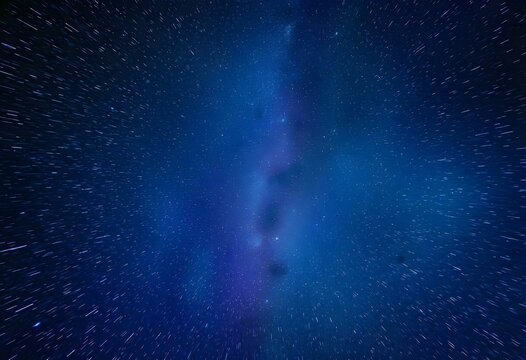 Milky Way galaxy core creating star trails with long exposure and zoom effect