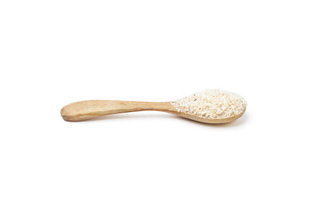 Psyllium husk powder on wooden spoon isolated on white background. Psyllium husk has increasing the volume of feces and amount of water in the intestines, It's used as a laxative to treat constipation