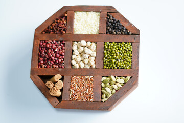 wooden box with cinnamon on white