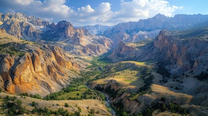 Mountain valley, rugged cliffs, sunlit landscape.