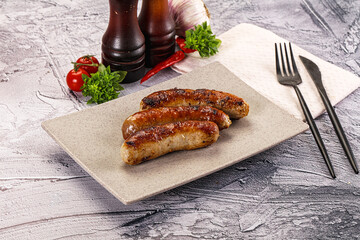 Delicous natural roasted sausages in the plate
