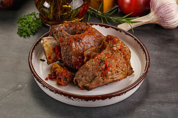 Baked beef ribs with vegetables