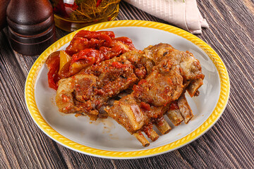 Baked lamb ribs with vegetables