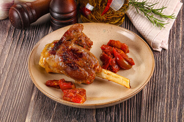 Baked lamb shank with vegetables