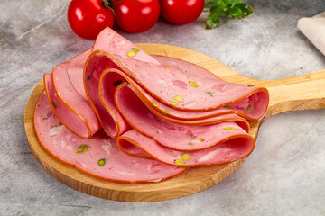 Mortadella pork sausages slices heap