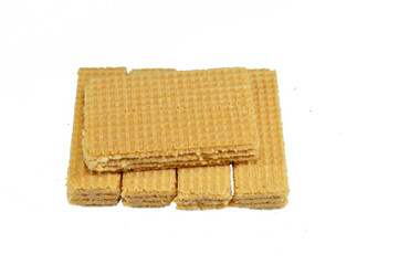 layers of wafer biscuits filled with creamy vanilla, a wafer is a crisp, sweet, very thin, flat, light biscuit,  creamy vanilla sandwiched in wafers, treat time biscuit, selective focus