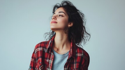 Fototapeta premium Joyful woman standing in casual attire, captured in a relaxed pose with vibrant studio lighting, on solid white background, single object