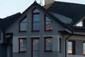 The modern residential buildings in the urban area feature a wide variety of architectural styles and designs that are striking