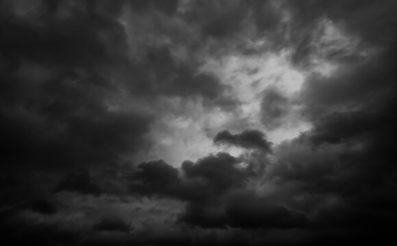 dark dramatic sky with black stormy clouds before rain as abstract background, extreme weather
