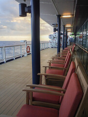Outdoor deck patio terrace with lounge furniture and bar onboard luxury modern cruiseship cruise...