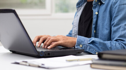 man hand typing on laptop for work, online learning, online shopping  searching data, online...