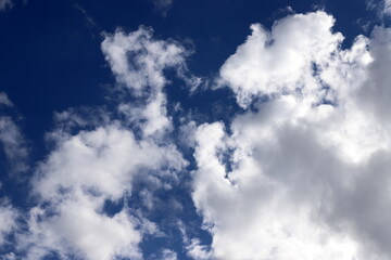 white clouds are floating across the sky