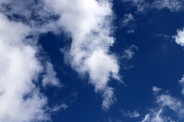 white clouds are floating across the sky