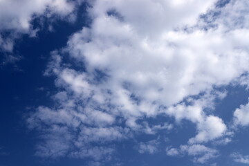 white clouds are floating across the sky