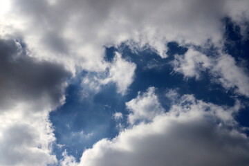 white clouds are floating across the sky