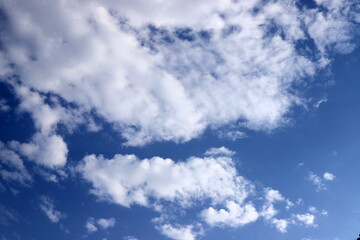 white clouds are floating across the sky