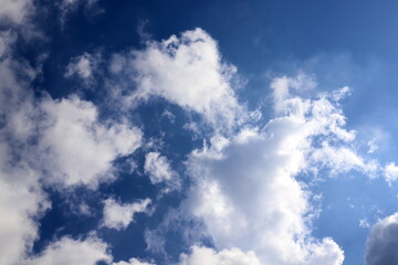 white clouds are floating across the sky