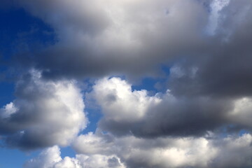 white clouds are floating across the sky