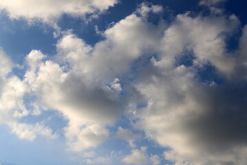 white clouds are floating across the sky